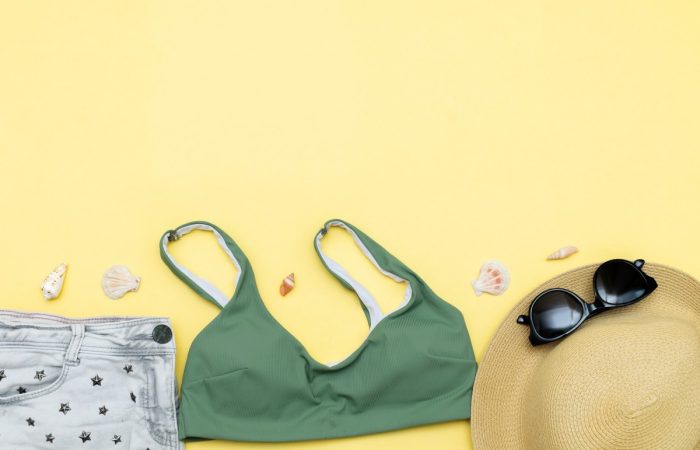Travel vacation summer flat lay, accessories objects, hat, sunglasses, clothes,bathing suit